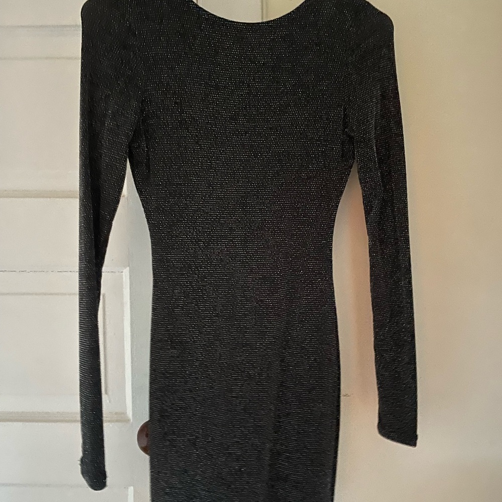 Sparkle black dress with open back .